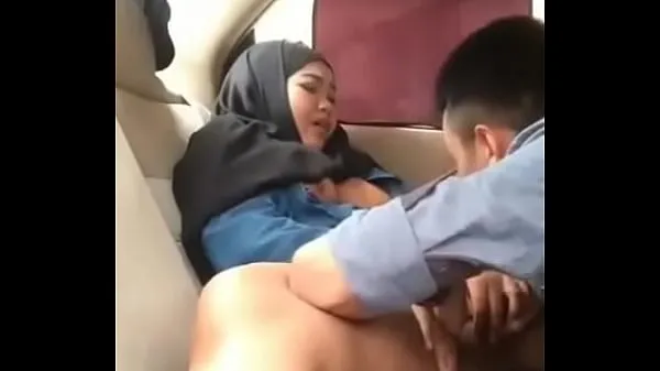 Hijab girl in car with boyfriend